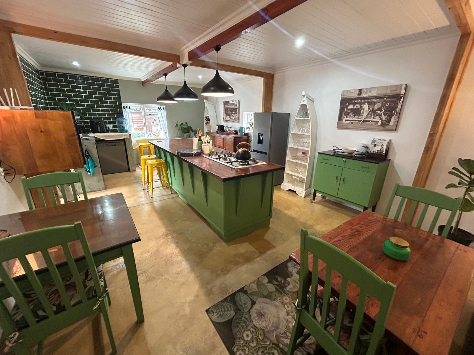 Kitchen wide view with dining tables